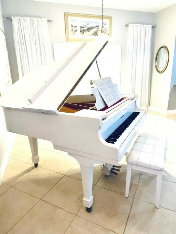 Gorgeous White baby grand piano